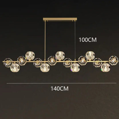 Gold-toned decorbites crystal chandelier with faceted crystal spheres suspended on a bar for living and dining rooms