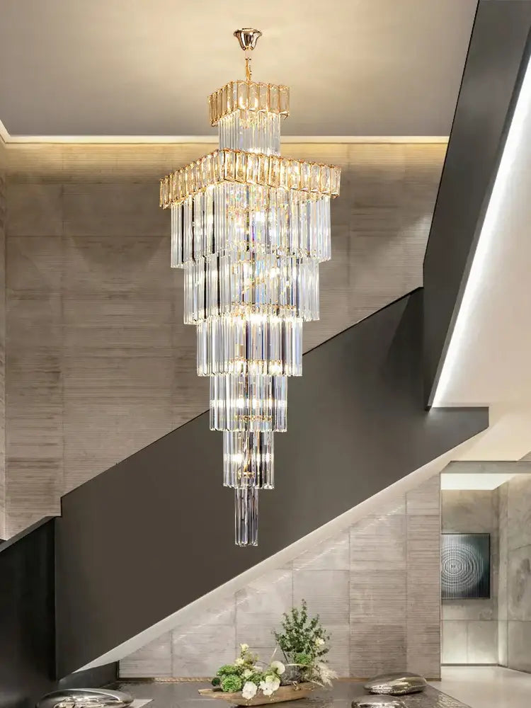 DecorBites crystal chandelier with multi-tiered crystals and gold-toned accents for luxury spiral staircase lighting