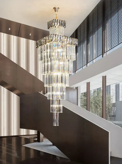 Decorbites crystal chandelier with gold-toned mount and cascading rectangular prisms for luxury spiral staircase lighting