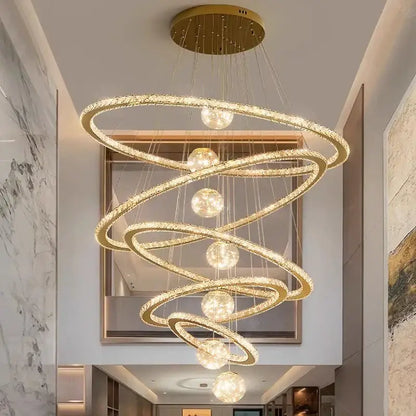 Golden spiral decorbites crystal chandelier featuring crystal-encrusted rings and spherical lights for indoor lighting