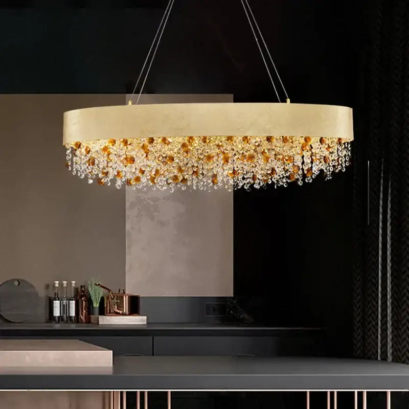Decorbites crystal chandelier with gold tone circular frame and cascading amber and clear crystal droplets for living room