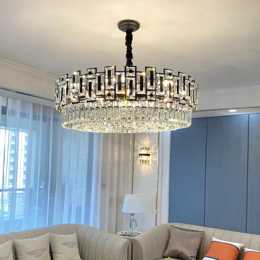 A modern decorbites crystal chandelier with black metal frame and cascading clear glass prisms for elegant lighting