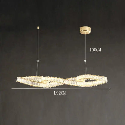 Gold-toned infinity-shaped decorbites crystal chandelier with crystal accents and led lighting for dining and living rooms