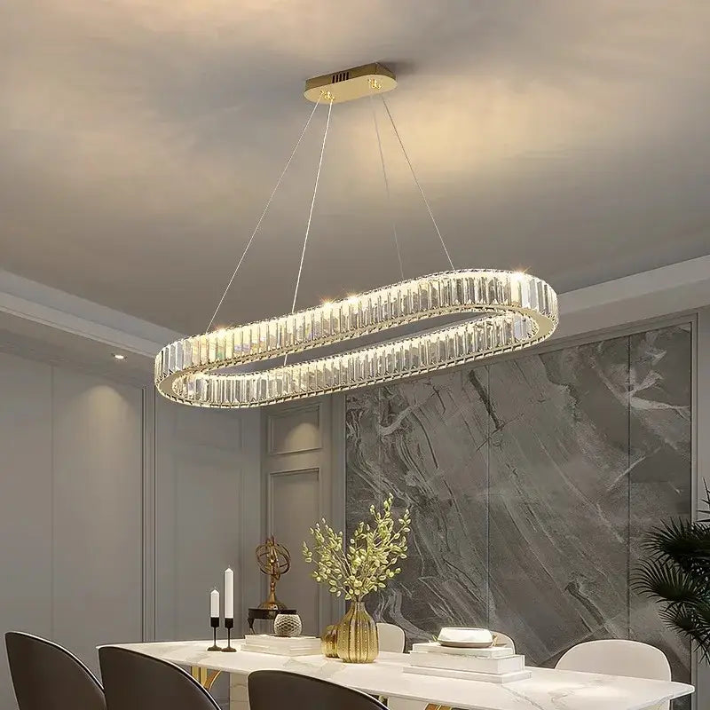 A decorbites crystal chandelier with gold mount and clear crystal prisms for modern living and dining rooms