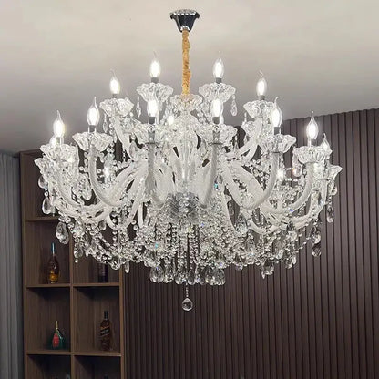 A decorbites crystal chandelier with intricate curved arms and dangling teardrop crystals for living and dining rooms