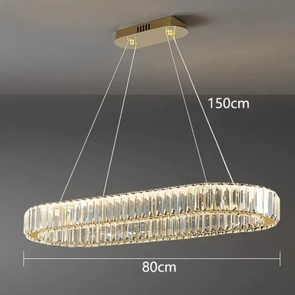 Gold-toned decorbites crystal chandelier with two concentric rings of faceted crystals for living and dining rooms
