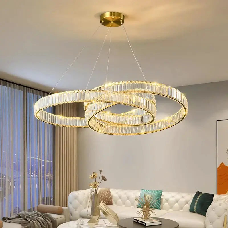 Gold-toned double-ring decorbites crystal chandelier with clear crystal accents for modern home and dining room lighting