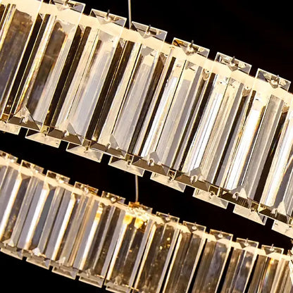 A decorbites crystal chandelier pendant light with clear faceted crystal bars and sleek metallic frame for modern interiors