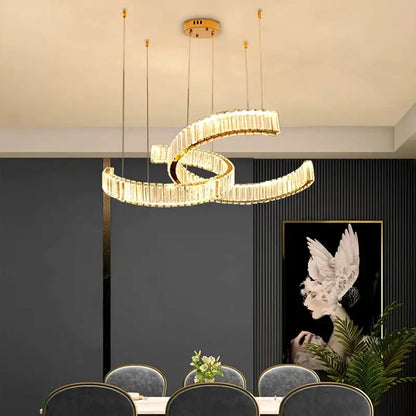 Gold-toned decorbites crystal chandelier pendant light with intertwined crystal-encrusted rings for modern interiors