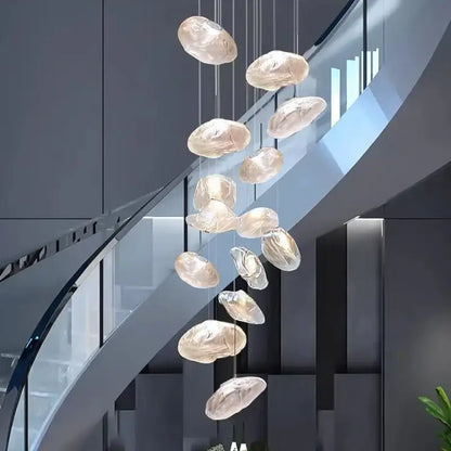 A modern DecorBites crystal chandelier with translucent glass orbs in a cascading design for living room lighting