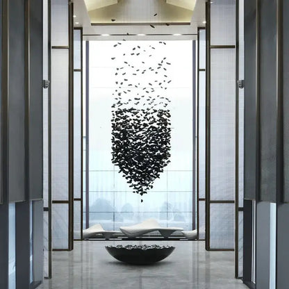 Black modern sculptural decorbites crystal chandelier with cascading leaf-like elements and matching bowl for staircases