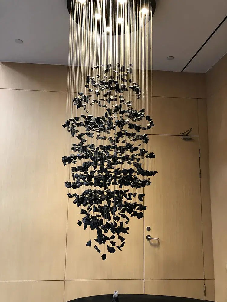 Black shard-like decorbites crystal chandelier with modern led design hanging from ceiling for staircase and lobby lighting