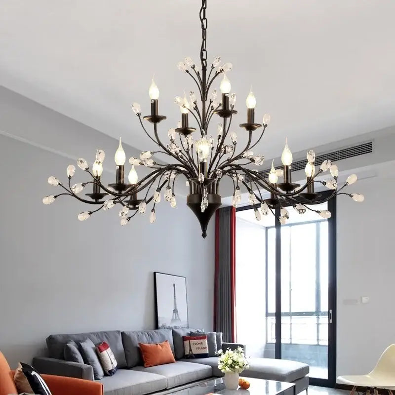 Black wrought iron decorbites crystal chandelier with crystal accents and candle-style bulbs for modern vintage lighting