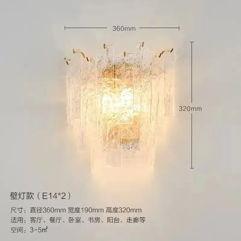 A warm glowing decorbites crystal chandelier wall lamp with textured glass and gold-toned metal accents for home decor