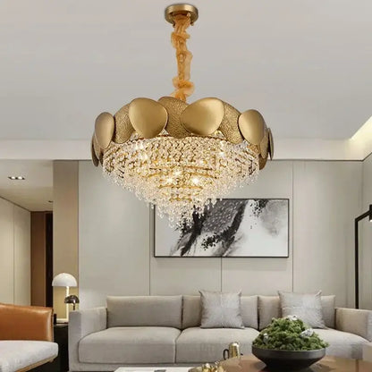 Gold-toned lotus-shaped decorbites crystal chandelier with textured metallic petals and cascading crystal droplets for living room