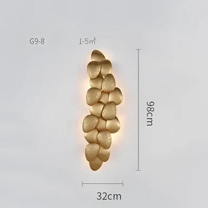 Gold-toned textured stone-like wall sconce with modern stacked design for decorbites crystal chandelier collection