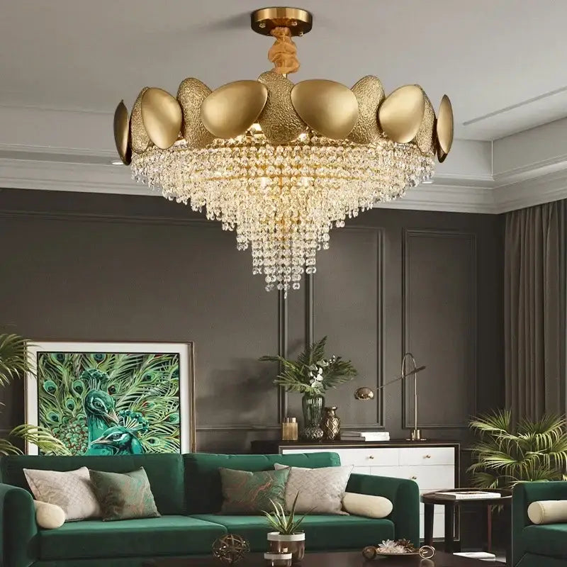 Gold-toned decorbites crystal chandelier with modern petal design and cascading crystal droplets for living room lighting