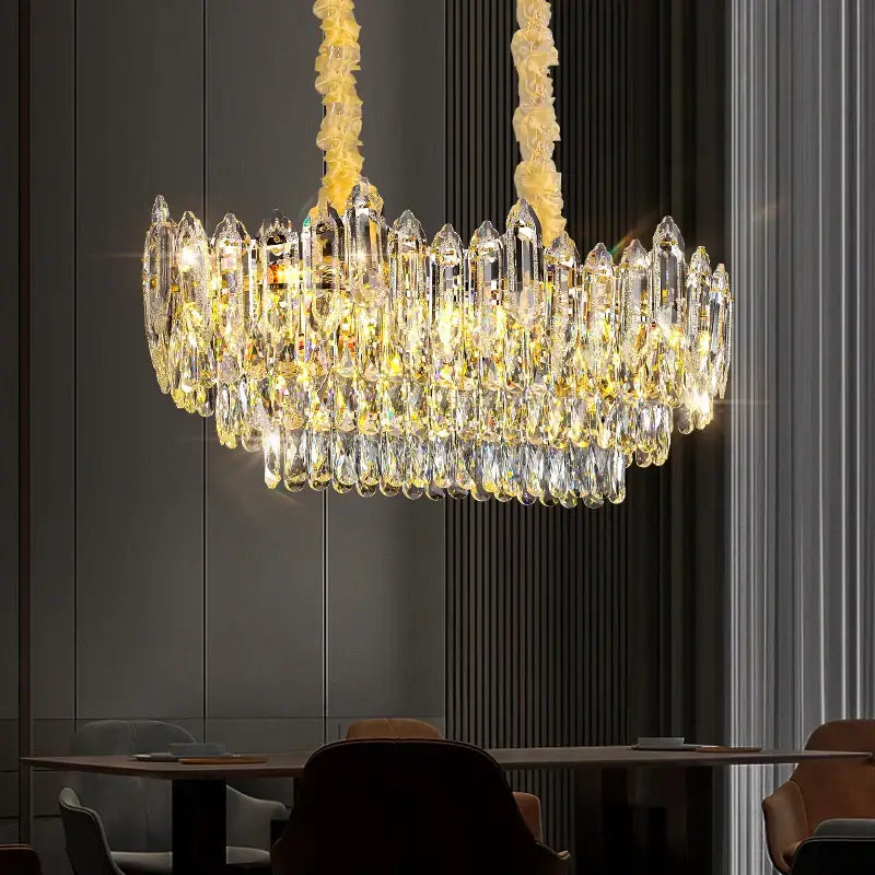 Luxurious decorbites crystal chandelier with cascading clear and golden yellow glass prisms for modern living spaces