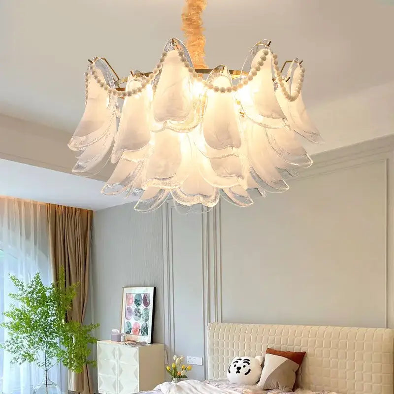 Elegant white glass decorbites crystal chandelier with pearl accents and gold-toned frame for modern luxury lighting