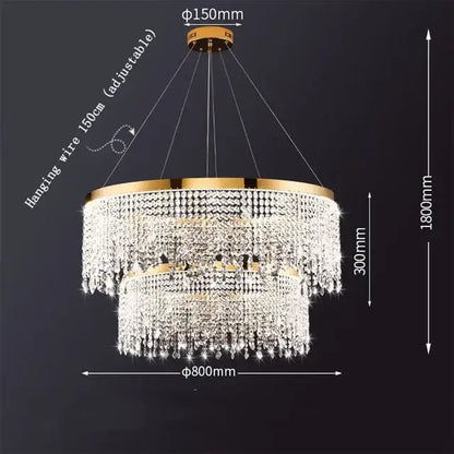 Gold-toned two-tier decorbites crystal chandelier with cascading clear crystal droplets and circular brass frame for modern rooms