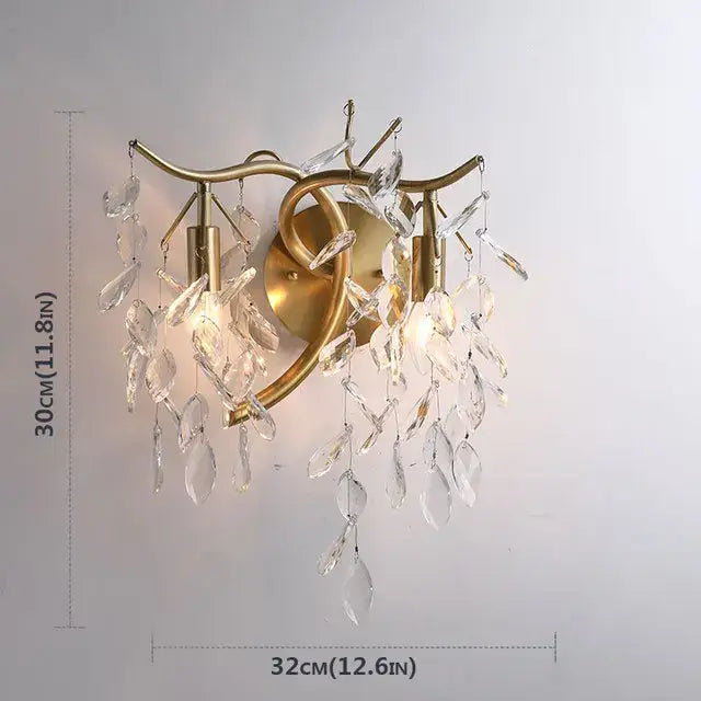 Gold-toned wall sconce with dangling crystal teardrop pendants for decorbites crystal chandelier modern luxe lighting