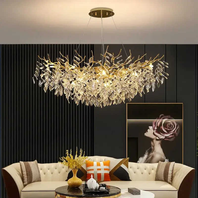 Gold-toned decorbites crystal chandelier with intricate crystal leaf and branch design for living room and hotel use