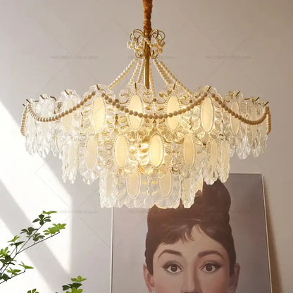 DecorBites crystal chandelier with gold-toned metal, pearl-like beads, and oval glass panels for modern luxury lighting