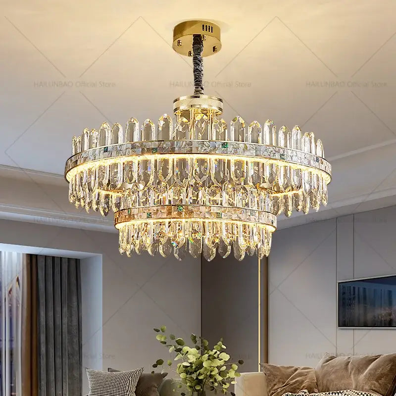 Luxurious decorbites crystal chandelier with gold-toned metal and clear prisms emitting warm glow for modern living spaces