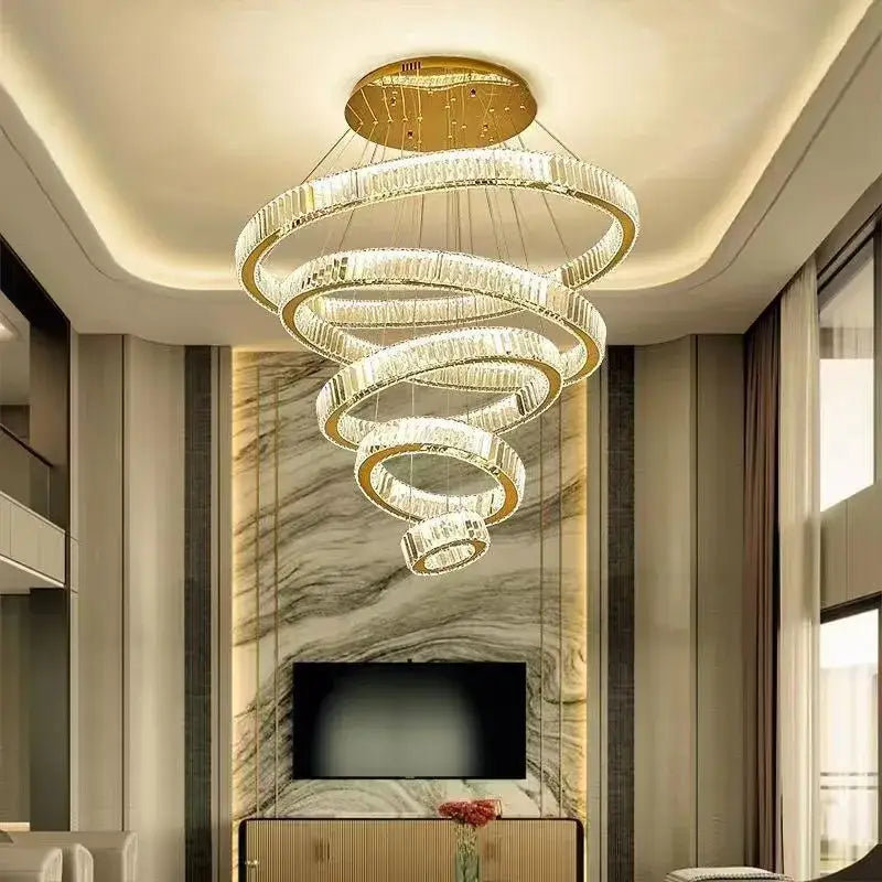 Modern spiral crystal chandelier with polished gold rings and clear crystals by decorbites for villa lighting