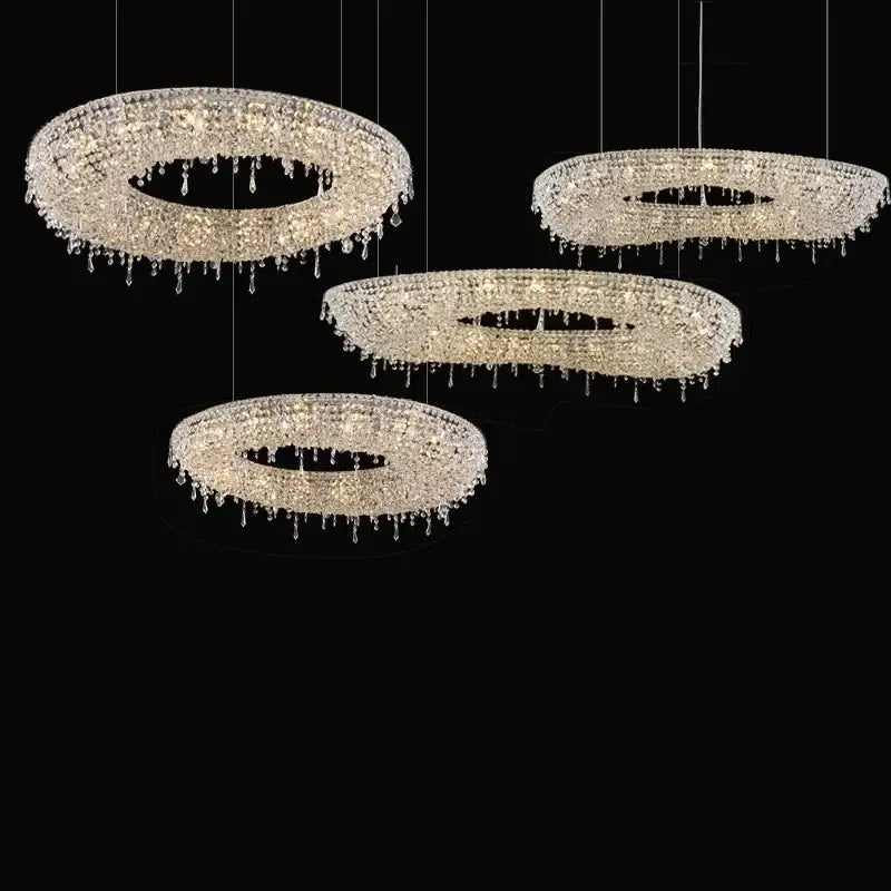 Four elegant decorbites crystal chandelier pendant lights with crystal-encrusted circular frames and teardrop crystals