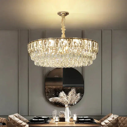 Decorbites crystal chandelier with cascading clear faceted crystals and gold-toned frame for modern luxury lighting