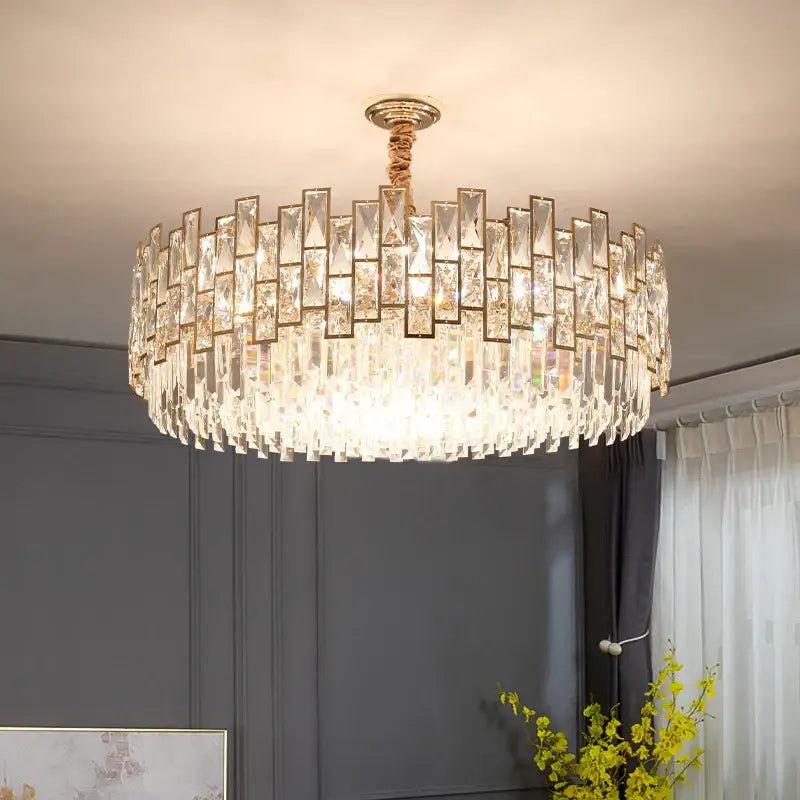 Decorbites crystal chandelier with clear faceted prisms in concentric rings and gold metal frame for modern luxury lighting