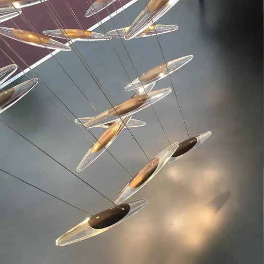 Modern minimalist decorbites crystal chandelier with transparent glass teardrop pendants and gold metallic centers