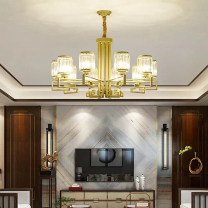 Gold-toned decorbites crystal chandelier with clear glass shades and geometric metal arms for modern luxury lighting