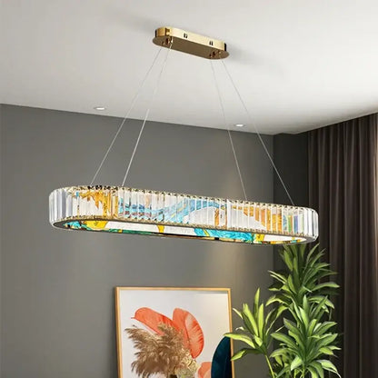 Modern decorbites crystal chandelier pendant lamp with gold mount, clear crystal prisms, and blue yellow stained glass panel