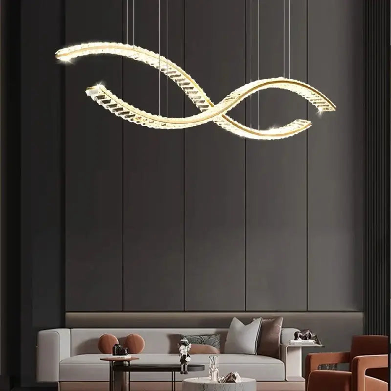 A modern decorbites crystal chandelier pendant lamp with gold metallic infinity frame and crystal accents for living room