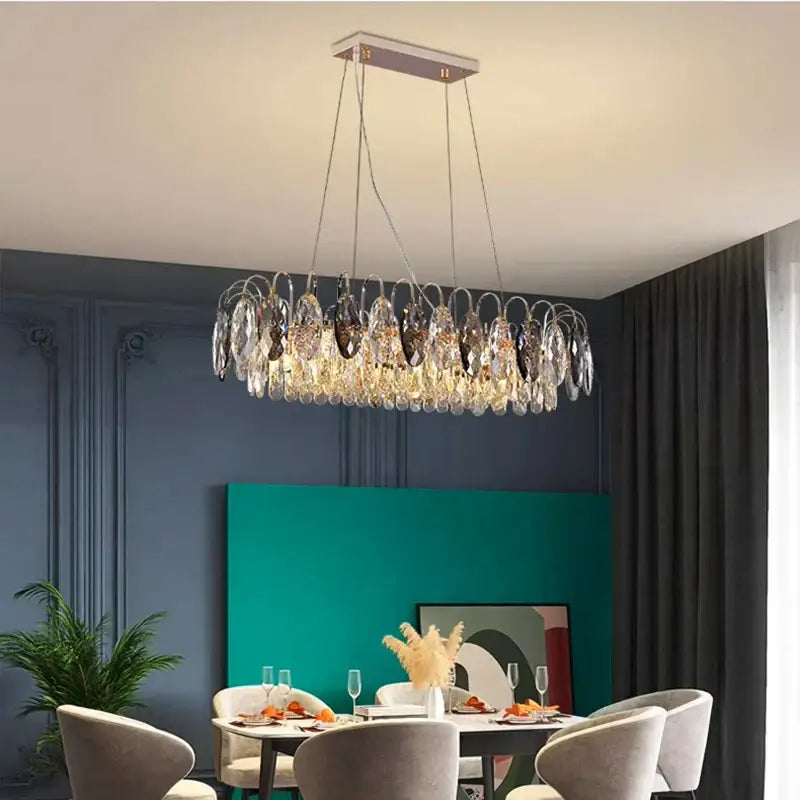 A decorbites crystal chandelier pendant light with clear crystal teardrop pendants and sleek rectangular ceiling mount