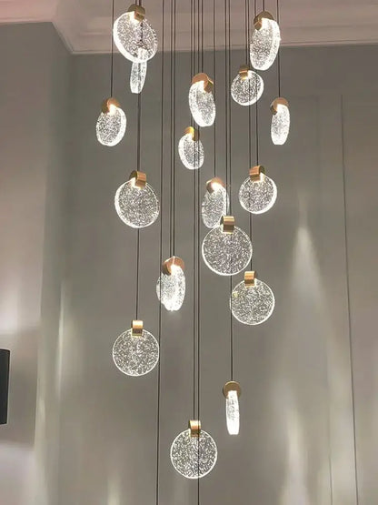 A decorbites crystal chandelier pendant light with gold-toned metal and crackled glass orbs for luxury staircase