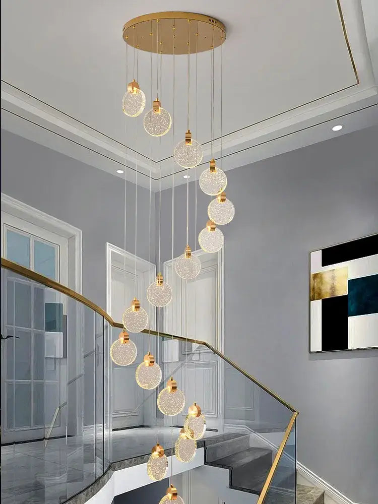 Golden circular decorbites crystal chandelier pendant light with dangling crystal globes for luxury staircase