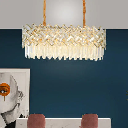 A modern decorbites crystal chandelier pendant light with clear crystal rods and glass prisms, perfect for home decor