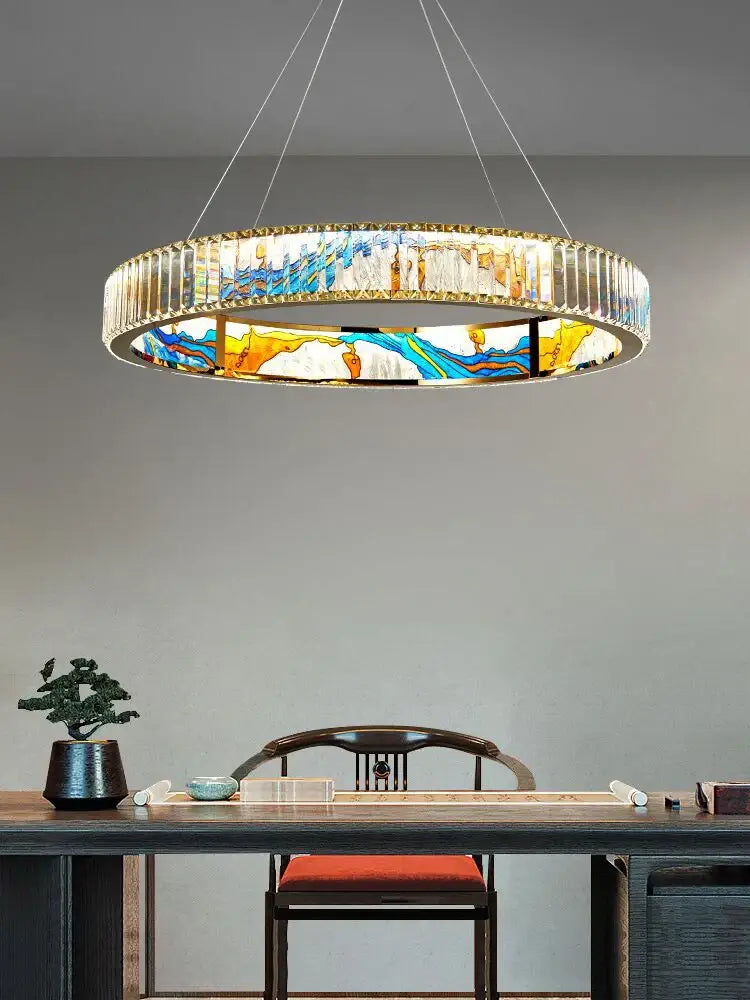 A decorbites crystal chandelier ring light featuring vibrant blue yellow and white stained glass for modern interiors