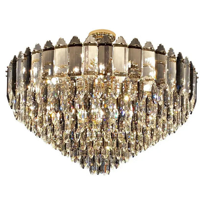 A decorbites crystal chandelier heart-shaped with cascading clear and smoky crystal prisms and gold-toned frame