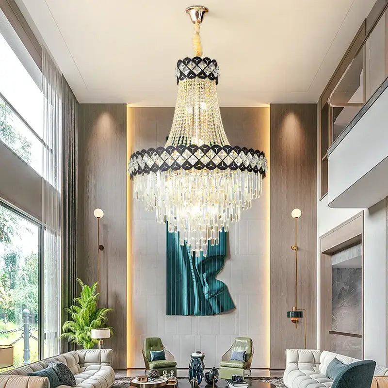 A decorbites crystal chandelier with a black and gold frame and cascading clear crystals in a tiered spiral design