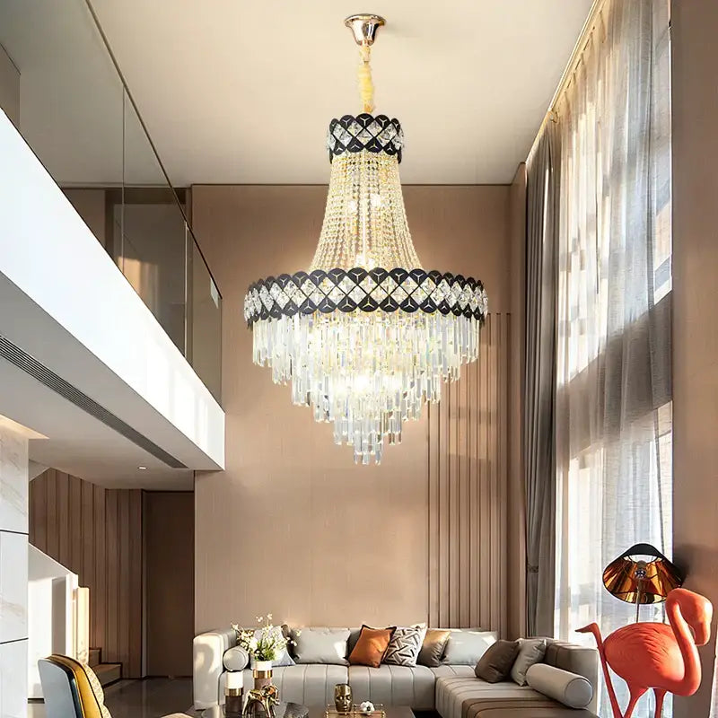 A decorbites crystal chandelier with black and gold frame and cascading clear crystals for spiral staircase lighting
