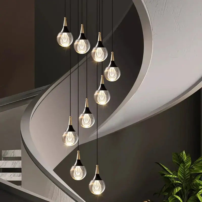 Modern glass pendant lights with gold-toned metal accents in decorbites crystal chandelier stair pendant lamp for living room lighting
