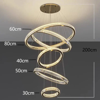 Modern decorbites crystal chandelier with interlocking rings and clear crystal elements lit by warm led lights for living room
