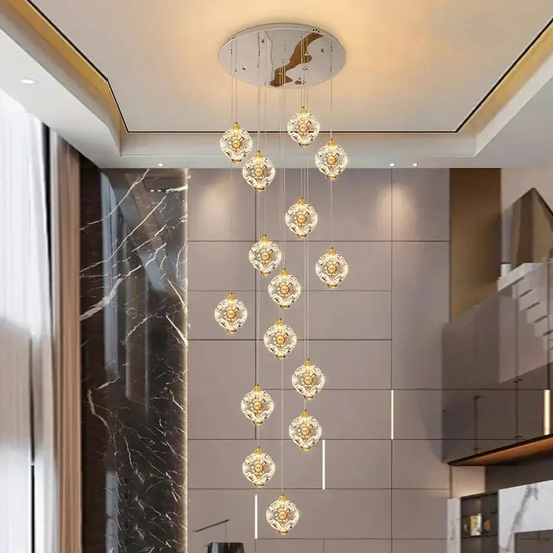 Decorbites crystal chandelier pendant lamp with gold-toned circular mount and multiple glass orbs for stair lighting