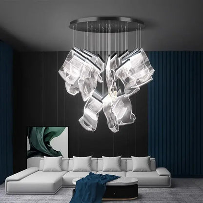 Modern decorbites crystal chandelier with translucent sculptural glass elements and metallic circular base for living room lighting