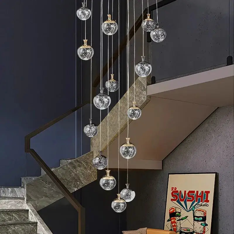 A decorbites crystal chandelier stair pendant lamp with clear crackled glass globes and gold-toned metal fixtures