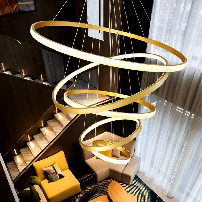 Golden spiral decorbites crystal chandelier stair pendant lamp with glowing rings suspended by thin cords for interior lighting